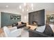 Cozy living room featuring a modern fireplace, stylish seating, and custom built-in storage for added comfort at 5145 S Clarkson St, Greenwood Village, CO 80121