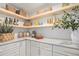 Well-organized pantry featuring open shelving, marble countertop, and modern decor with ample storage space at 5145 S Clarkson St, Greenwood Village, CO 80121