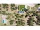 Overhead view of a home, outbuilding, driveway, and lush surrounding landscape, property boundary in white at 33589 Robin Ct, Elizabeth, CO 80107