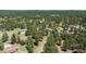 View of a home and outbuilding with green roofs, in a densely wooded area at 33589 Robin Ct, Elizabeth, CO 80107