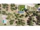 Overhead view of a home, outbuilding, driveway, and lush surrounding landscape, property boundary in white at 33589 Robin Ct, Elizabeth, CO 80107