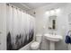 This bathroom features a shower and tub, sink, toilet, and modern vanity at 33589 Robin Ct, Elizabeth, CO 80107