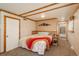 Relax in this cozy carpeted bedroom with natural wood trim and mountain decor at 33589 Robin Ct, Elizabeth, CO 80107