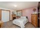 This cozy bedroom features a fireplace, closet, and a large window for natural light at 33589 Robin Ct, Elizabeth, CO 80107
