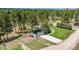 Exterior of a home with a green roof, long driveway, and attached garage at 33589 Robin Ct, Elizabeth, CO 80107