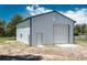 Large metal outbuilding with a roll-up door, ideal for use as a shop, garage or storage at 33589 Robin Ct, Elizabeth, CO 80107