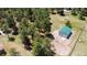 Aerial view of a metal outbuilding with green roof, adjacent to treed area at 33589 Robin Ct, Elizabeth, CO 80107