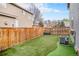 Well-maintained backyard with artificial turf, providing a clean and green space with a wood fence at 1271 Braewood Ave, Highlands Ranch, CO 80129