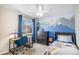 This cozy bedroom features stylish blue mountain wall art, study desk, and ceiling fan at 1271 Braewood Ave, Highlands Ranch, CO 80129