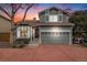 Charming two-story home with a well-manicured lawn, attached garage, and inviting entrance at 1271 Braewood Ave, Highlands Ranch, CO 80129