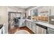 Eat-in kitchen featuring stainless steel appliances, granite countertops, and hardwood floors at 1271 Braewood Ave, Highlands Ranch, CO 80129