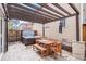 Outdoor patio featuring a hot tub, wooden pergola, and a dining set, perfect for relaxation and entertaining at 1271 Braewood Ave, Highlands Ranch, CO 80129