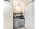 Convenient wet bar with granite countertop, mini fridge, open shelf, and mini cabinet at 1271 Braewood Ave, Highlands Ranch, CO 80129