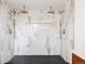 Spa-like bathroom with large walk-in shower and double shower heads at 5095 Umatilla St, Denver, CO 80221