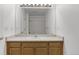 Bathroom has wood cabinets, white countertops, and a shower/tub at 3261 S Waco Ct # K, Aurora, CO 80013