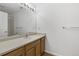 Clean bathroom with a modern vanity, a large mirror, and a shower-tub combo for comfort at 3261 S Waco Ct # K, Aurora, CO 80013