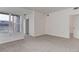 Bright bedroom with carpet, white walls, and natural light from a large window at 3261 S Waco Ct # K, Aurora, CO 80013