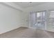 Carpeted bedroom features a sliding door to an outdoor space at 3261 S Waco Ct # K, Aurora, CO 80013