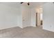 Bedroom with neutral carpet, ceiling fan, and two closets at 3261 S Waco Ct # K, Aurora, CO 80013