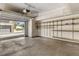 Attached garage with automatic door opener and built-in shelving, offering plenty of space for storage at 3261 S Waco Ct # K, Aurora, CO 80013