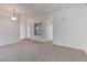 Bright living room with neutral carpet, with an entrance, and a door to the outside at 3261 S Waco Ct # K, Aurora, CO 80013