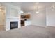 Inviting living room that leads to a cozy fireplace and open kitchen at 3261 S Waco Ct # K, Aurora, CO 80013