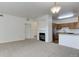 Spacious living room with a fireplace that leads to the kitchen at 3261 S Waco Ct # K, Aurora, CO 80013