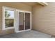 A covered patio with sliding glass doors invites relaxation and indoor-outdoor living at 3261 S Waco Ct # K, Aurora, CO 80013