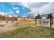 Expansive backyard featuring a pergola with string lights and a spacious lawn at 9510 Flower St, Broomfield, CO 80021