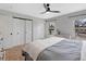 Bright bedroom features a ceiling fan, and a light gray color scheme at 9510 Flower St, Broomfield, CO 80021