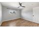 Empty bedroom features wood flooring, neutral walls, and window view at 9510 Flower St, Broomfield, CO 80021