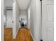 Hallway of a home with hardwood flooring, showcasing its clean and inviting entryway at 9510 Flower St, Broomfield, CO 80021