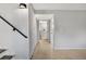 Hallway view featuring closet, carpet, neutral paint and a partial view into the bathroom with a tiled shower at 9510 Flower St, Broomfield, CO 80021