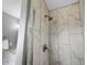 Modern bathroom with a tiled shower, silver shower head and fixtures at 9510 Flower St, Broomfield, CO 80021