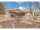 Charming one-story house with back patio and unique rock landscaping at 3596 E Fair Pl, Centennial, CO 80121