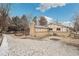 Backyard with snow and patio near house at 3596 E Fair Pl, Centennial, CO 80121