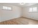 Bedroom with hardwood floors and two windows allowing natural light at 3596 E Fair Pl, Centennial, CO 80121