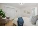 Bright bedroom with hardwood floors, closet, accent chair, and natural light at 3596 E Fair Pl, Centennial, CO 80121