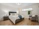 Calm and inviting bedroom with hardwood floors, natural light, and neutral color scheme at 3596 E Fair Pl, Centennial, CO 80121