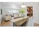 Cozy dining area adjacent to the living room and kitchen with wooden table and comfortable seating at 3596 E Fair Pl, Centennial, CO 80121