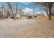 Charming single-story home with a curved driveway, attached garage, and low-maintenance landscaping at 3596 E Fair Pl, Centennial, CO 80121