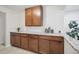 Extended granite countertop space with abundant cabinetry and modern neutral design at 3596 E Fair Pl, Centennial, CO 80121