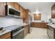 Modern kitchen featuring stainless steel appliances, granite countertops, and subway tile backsplash at 3596 E Fair Pl, Centennial, CO 80121