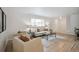 Bright and airy living room featuring hardwood floors and a large window for natural light at 3596 E Fair Pl, Centennial, CO 80121