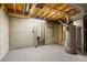 Unfinished basement area with exposed utilities at 4751 S Xenia St, Denver, CO 80237