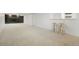 Spacious basement with neutral carpeting and a stone fireplace at 4751 S Xenia St, Denver, CO 80237