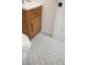 Modern bathroom with stylish wood vanity and patterned floor tiles at 4751 S Xenia St, Denver, CO 80237