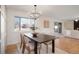 Dining area features a chandelier and hardwood floors at 4751 S Xenia St, Denver, CO 80237