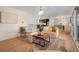 Open concept living room with adjacent kitchen and dining areas at 4751 S Xenia St, Denver, CO 80237