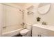 Full bathroom with shower-tub combo, modern vanity, and mirrored medicine cabinet at 13020 E Linvale Pl, Aurora, CO 80014